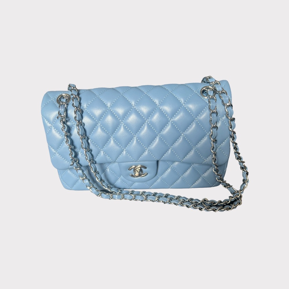 Caviar Quilted Medium Double Flap Bag 
In soft baby light blue; Only worn once